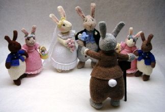 Knitted toys of a bunny wedding party