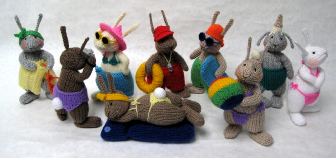 Knitted toys of a bunny beach party