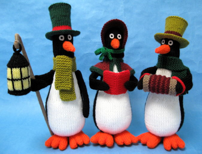 Knitted toys of a group of penguin carol singers