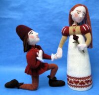 knitted toys of Romeo on one knee before Juliet