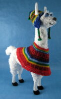 Llama knitted toy wearing traditional Andean dress