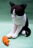 Black and white cat knitted toy