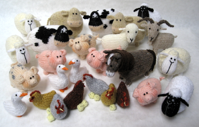 knitted toys of cartoon farmyard animals