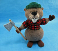 knitted toy of a beaver dressed as a lumberjack